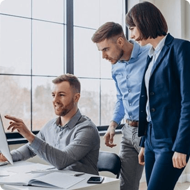 Team pointing at a screen